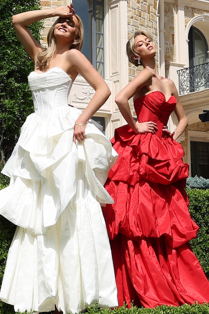 strapless layered ruffle ball gown - two girls front, contrasting vibrant gowns, expressive poses