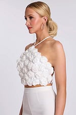 Side view of 3D floral halter crop top with sculpted rose details