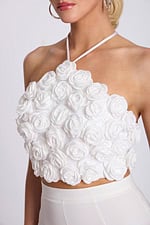Close-up of 3D rosette halter crop top floral appliqué details