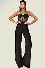 Black fitted jumpsuit featuring sheer bodice and spaghetti straps