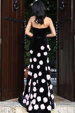 Black strapless gown with pink rose embellishments
