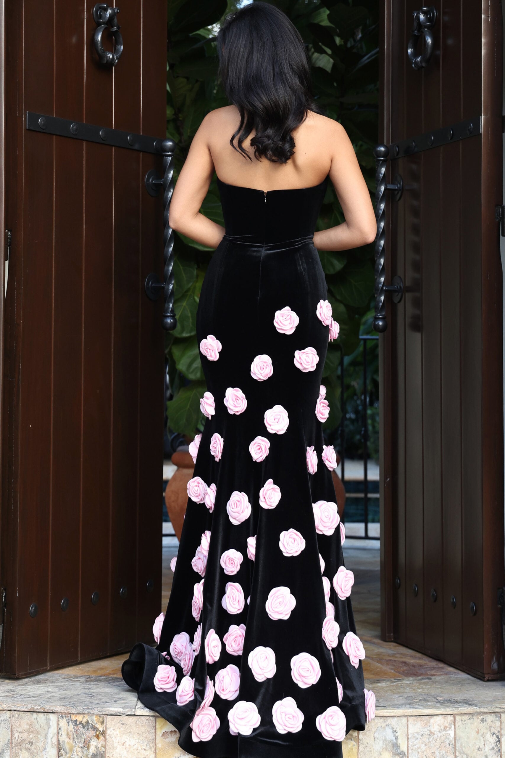Black strapless gown with pink rose embellishments