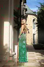 Sparkling green dress with side slit and intricate bead details