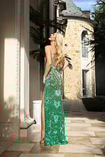 Backless green beaded dress with long silhouette and flowing hem