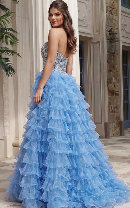 Strapless beaded bodice gown with open back and tiered ruffled skirt in sheer layered fabric