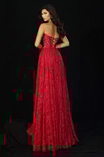Red lace evening gown featuring lace-up back and flowy skirt