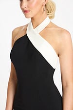 Close-up of white crossover neckline on mini dress