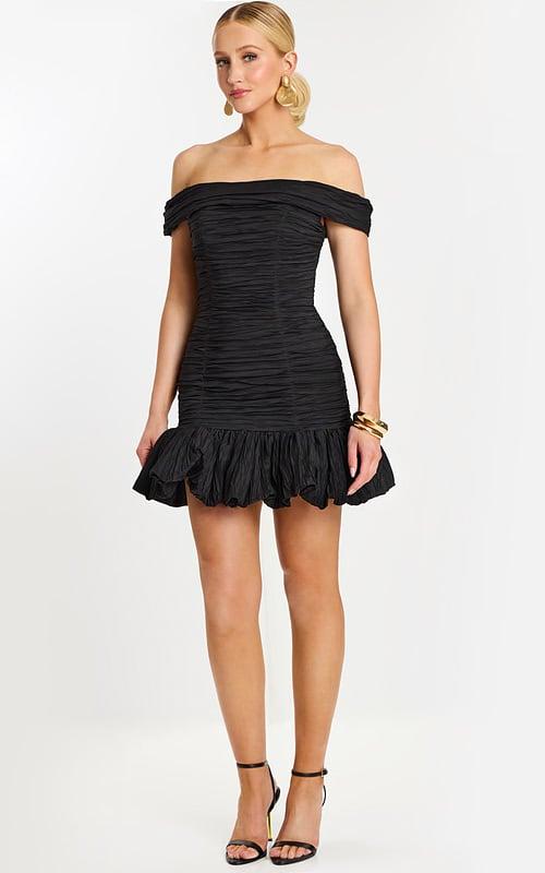 Back view of off-the-shoulder black mini dress with ruched texture