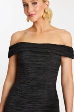 Close-up of crinkle ruched fabric on fitted off-shoulder mini dress