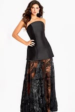 Strapless black gown with a structured mini overlay and sheer lace embroidered skirt creating a dramatic layered effect.