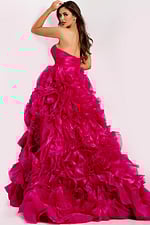 Glamorous strapless prom dress featuring dramatic layered flowers