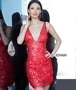 Model wearing Jovani 4552 red dress with floral sequins, full front view
