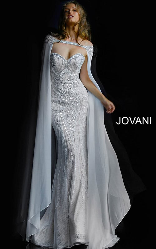 Model wearing Jovani 45566 ivory gown with sweetheart neckline and cape