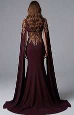 Column gown with embroidered back and extended cape sleeves