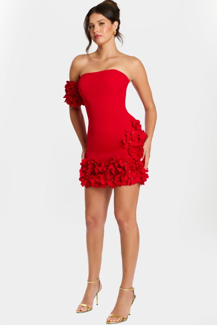 Full body view of red fitted mini dress with 3D flower trim