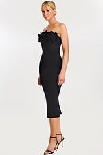Side view of fitted black sheath dress with 3D floral details