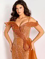 Off-shoulder beaded gown featuring an asymmetric ruffled bodice, thigh-high slit, and flowing tulle side train.