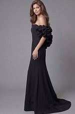 Side profile of Jovani 45653 black off-the-shoulder mermaid gown highlighting the dramatic rosette ruffle sleeve detail, clean bodice, and flowing train.