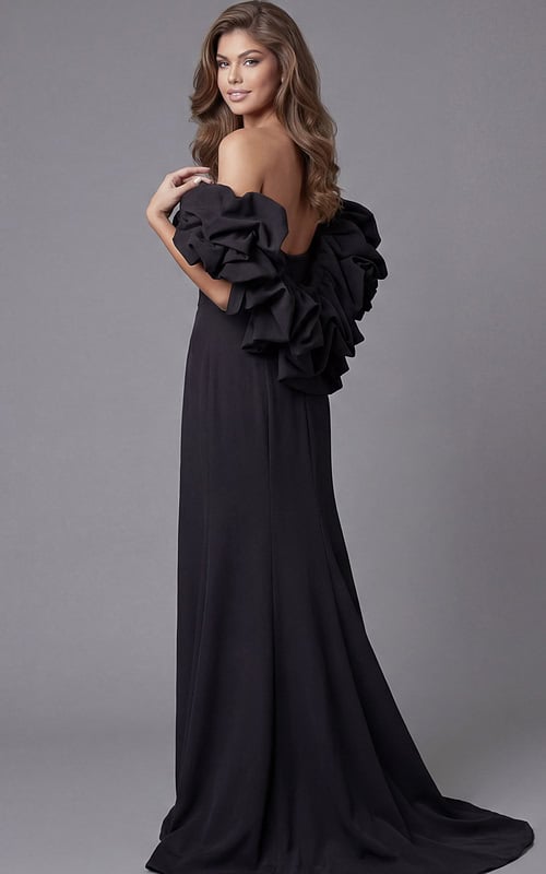 Back view of Jovani 45653 black mermaid gown showcasing voluminous sculptural ruffle off-the-shoulder sleeves, open back, and sweeping train.
