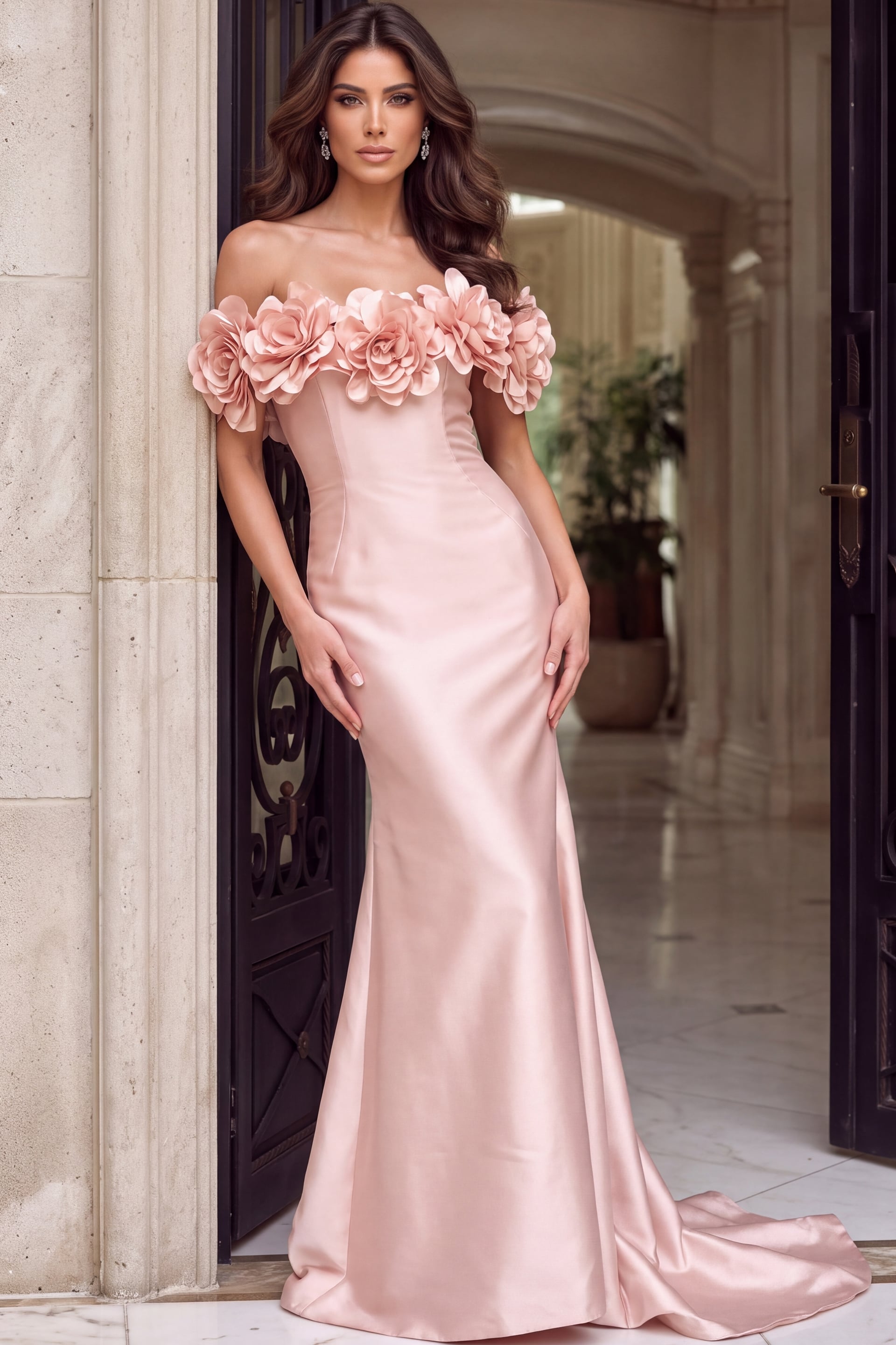 Close view of blush satin gown showing the fabric flower appliques along the neckline
