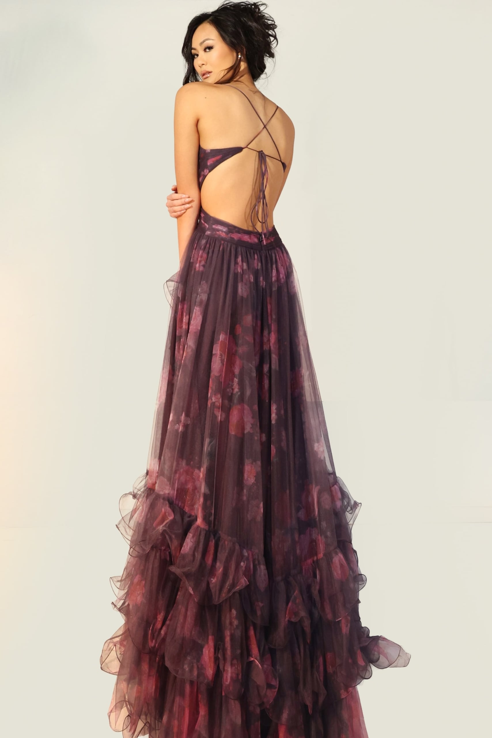 Layered tulle gown with floral pattern, high slit, and open lace-up back