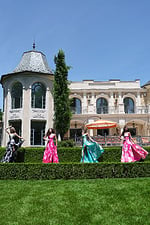 strapless jacquard gown with floral embroidery - four girls front, posing, vibrant flowing dresses