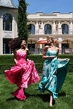 strapless jacquard gown with floral embroidery - two girls front, laughing, flowing skirts, barefoot