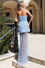 Strapless blue evening gown with textured floral design and long train