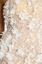 Ivory formal gown with leaf embroidery and dimensional flowers