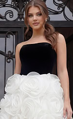 Close view of strapless black bodice paired with textured white floral skirt