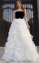 Strapless gown with black fitted bodice and voluminous white rosette skirt