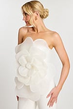 Side profile of model in off-white floral jumpsuit