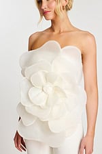 Detailed bodice view showing large flower on jumpsuit