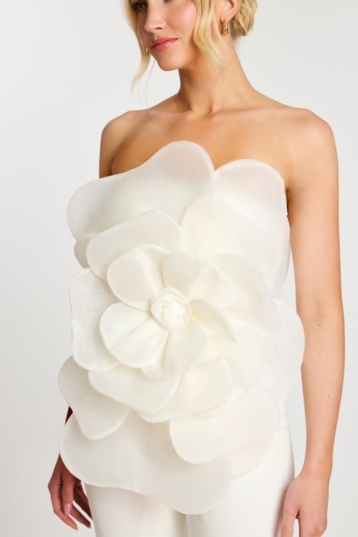 Detailed bodice view showing large flower on jumpsuit