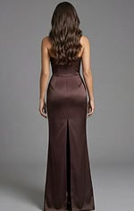 Back view of sleek evening gown with smooth satin finish and center slit