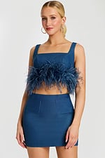 Angle View of Feathered Denim Crop Top and High-Waisted Mini Skirt