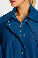 Close-Up of Snap Buttons and Zipper Hardware on Dark Blue Denim Cape Jacket