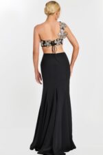 Back view of black skirt and floral lace-up crop top with flower appliqués