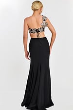 Back view of black skirt and floral lace-up crop top with flower appliqués