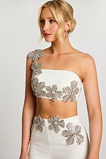 Close-up back of floral beading and strap on ivory crop top