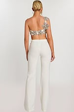 Back view of ivory jumpsuit with floral beaded strap and fitted pants