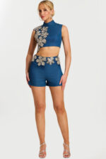 Front view of denim two-piece set with crystal floral appliqué