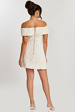 Back view of off-white dress with exposed zipper and fold-over neckline