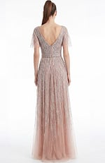 Back view of a beaded A line gown with V back and soft floor length silhouette