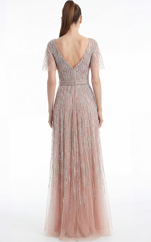 Back view of a beaded A line gown with V back and soft floor length silhouette