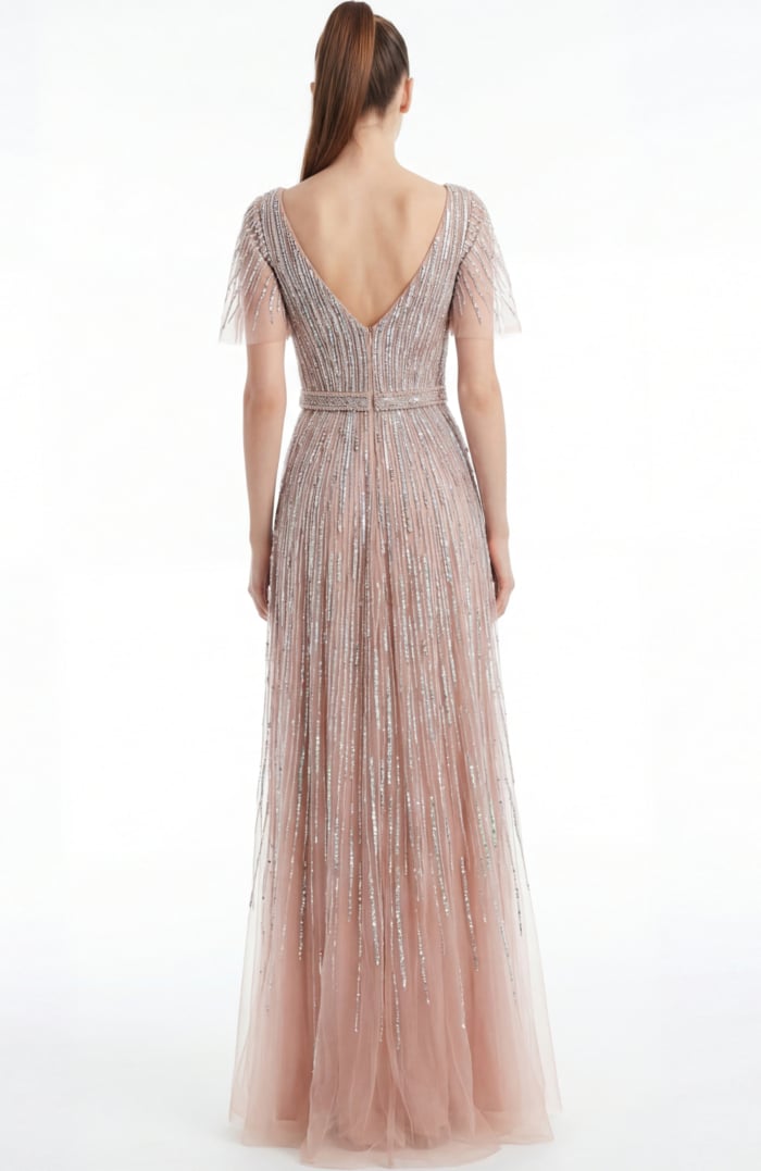 Back view of a beaded A line gown with V back and soft floor length silhouette
