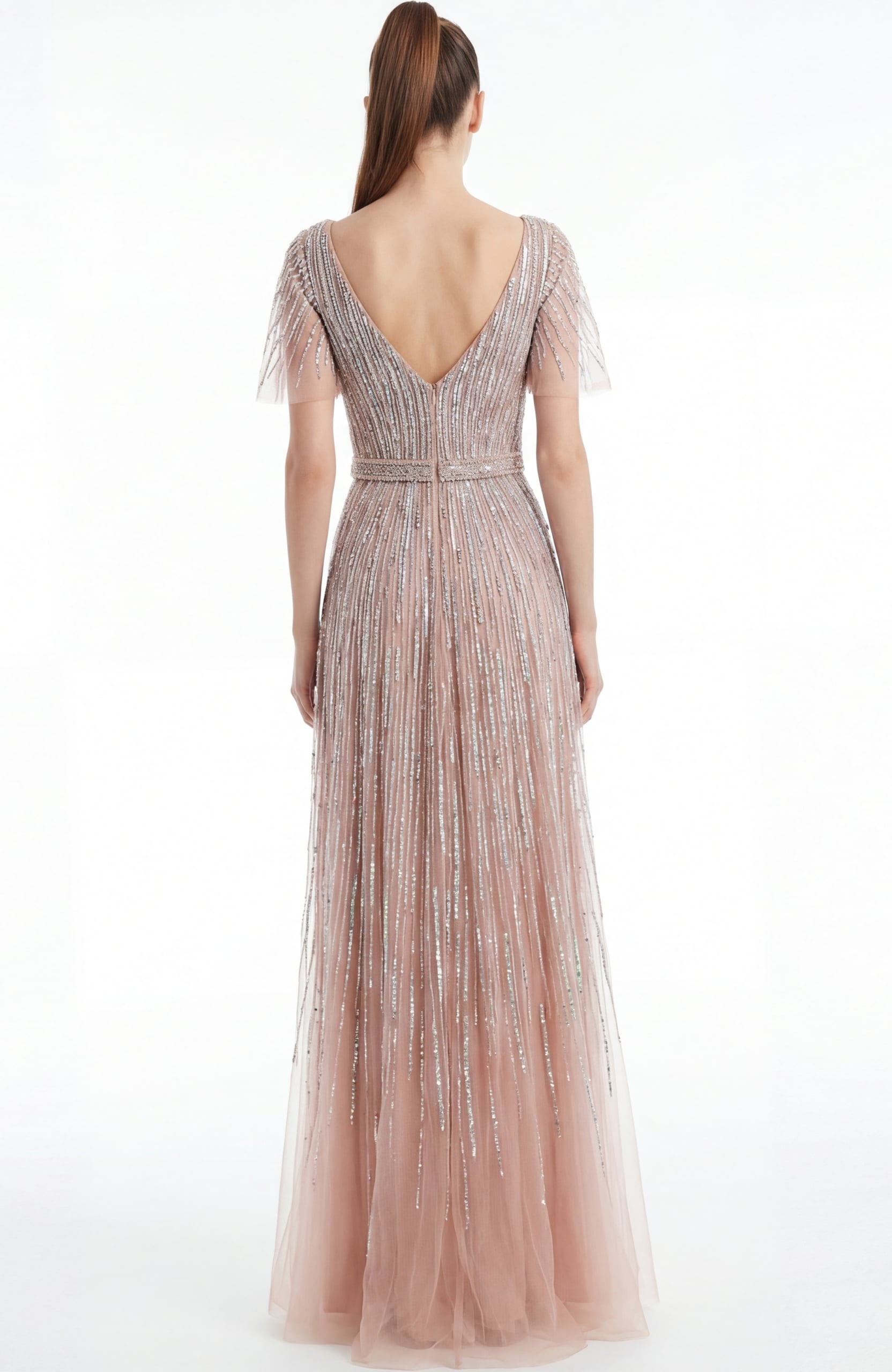 Back view of a beaded A line gown with V back and soft floor length silhouette