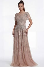 Side view of a beaded A line gown highlighting the sheer overlay and defined waist