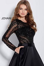 Model wearing Jovani 46066 black gown showcasing intricate beading.