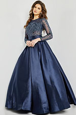 Model in Jovani 46066 navy gown with embellished top and flowing skirt